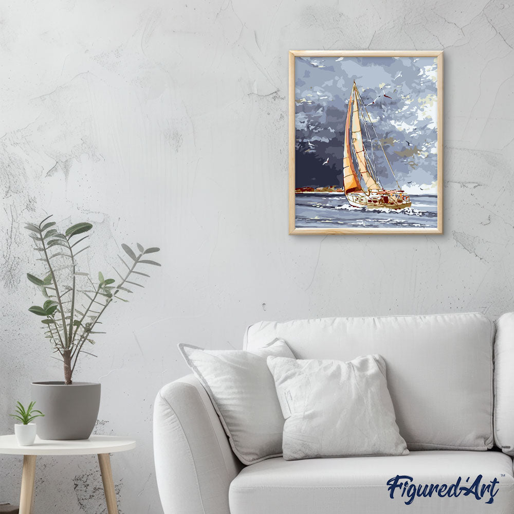 Sailboat and clouds by the water