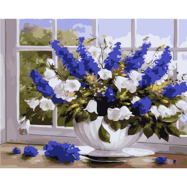 Vase of blue and white flowers