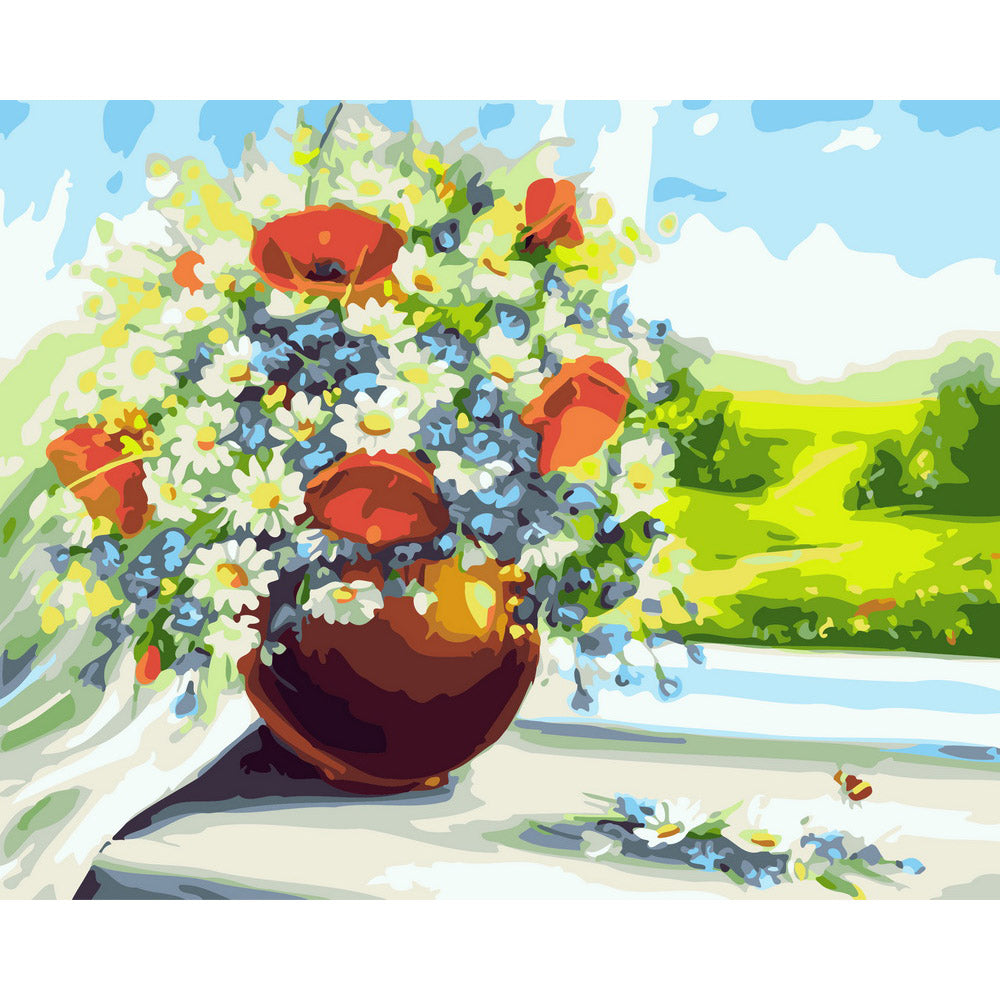 Vase of flowers with a view of the fields