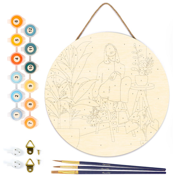 Paint by numbers on Wood Slice - Woman in the room with plants