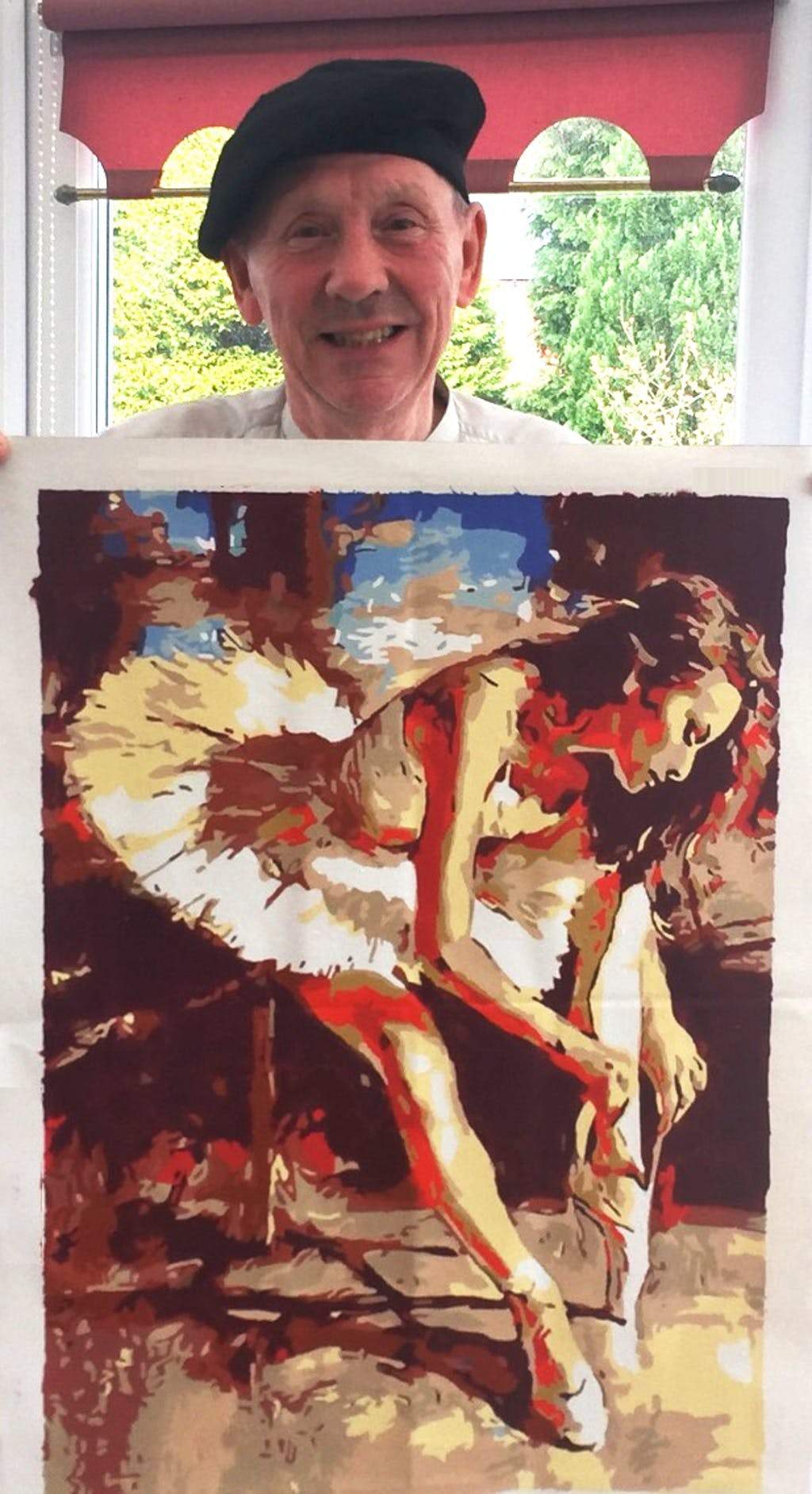 Robert showing his finished paint by numbers artwork